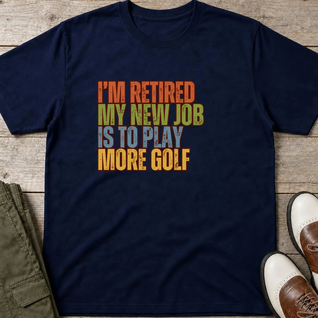 I'm Retired T-Shirt in Navy lying on a plain floor. T-shirt is a unisex cut and 100 per cent cotton.