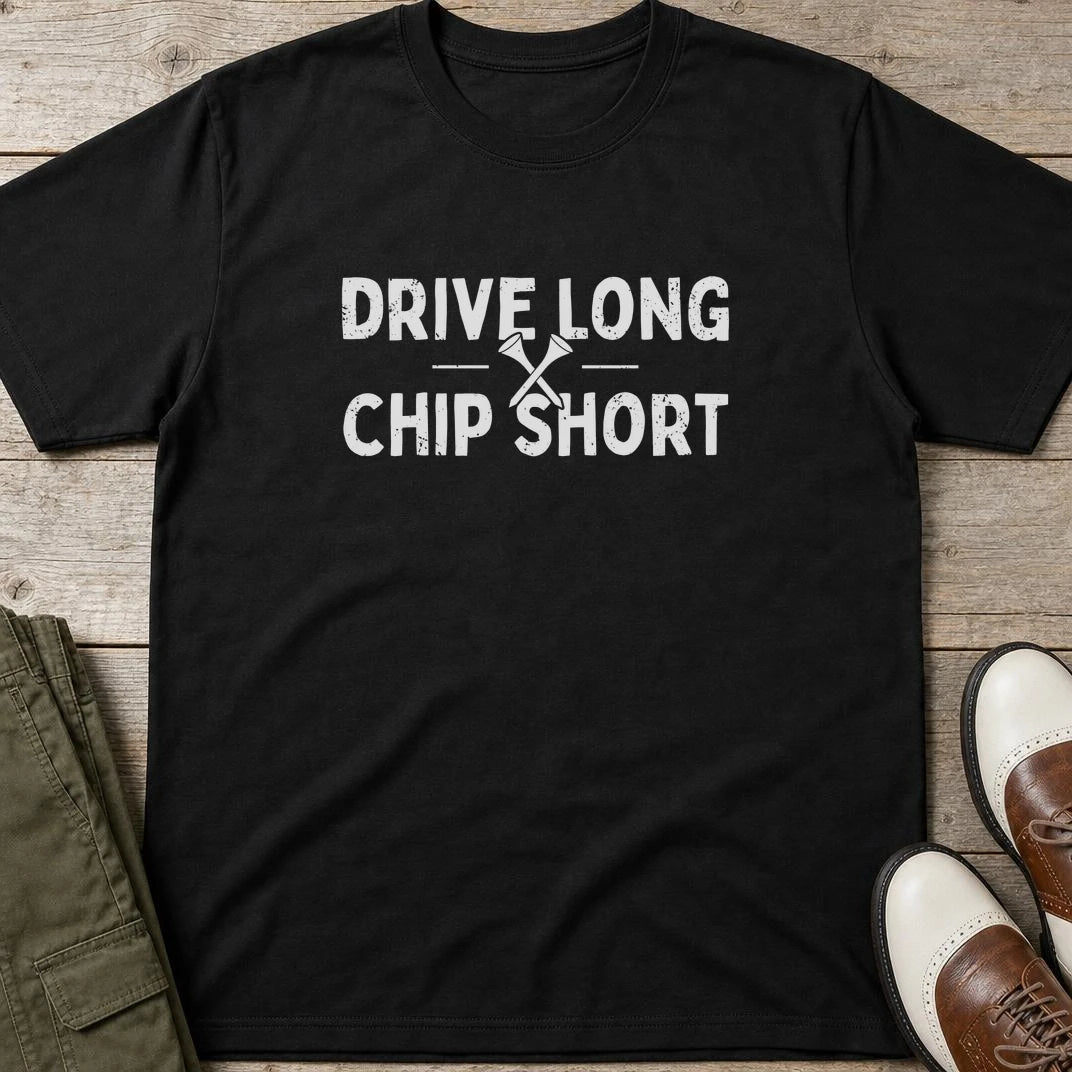 Chip Short T-Shirt in Black lying on a plain floor. T-shirt is a unisex cut and 100 per cent cotton.