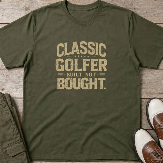 Built Not Bought T-Shirt in Military Green lying on a plain floor. T-shirt is a unisex cut and 100 per cent cotton.