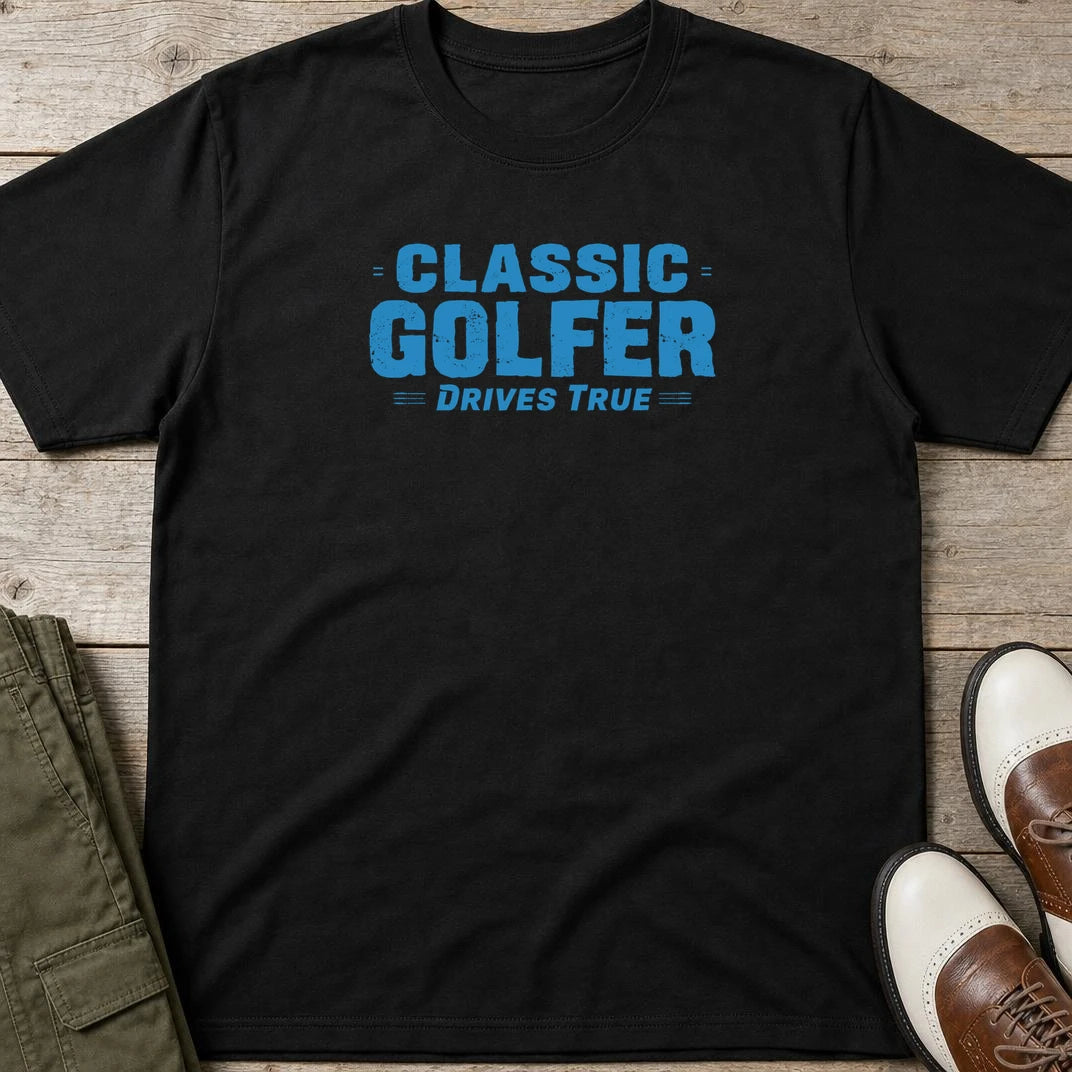 Drives True T-Shirt in Black lying on a plain floor. T-shirt is a unisex cut and 100 per cent cotton.
