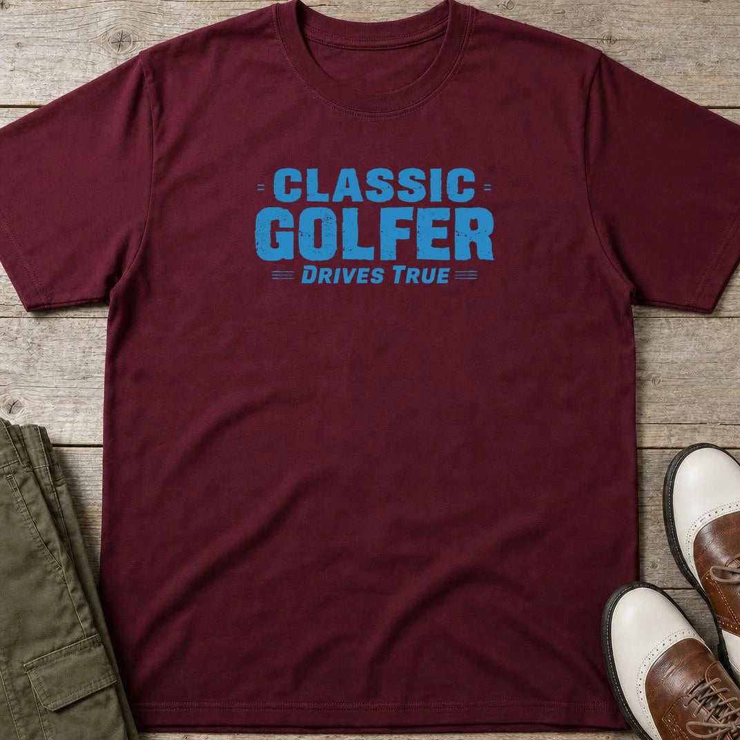 Drives True T-Shirt in Maroon lying on a plain floor. T-shirt is a unisex cut and 100 per cent cotton.