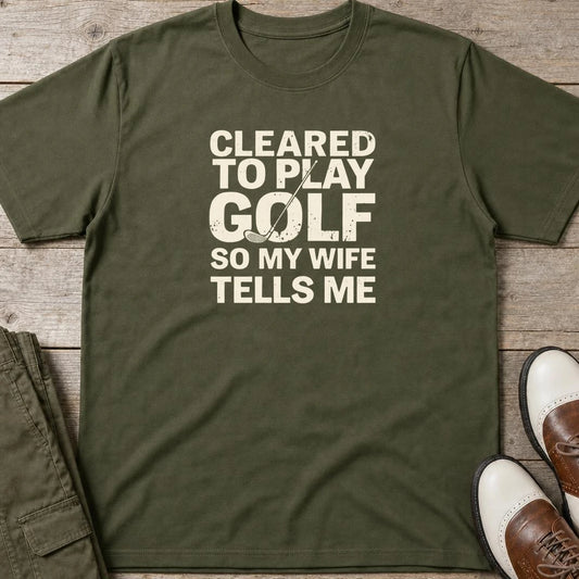 Cleared T-Shirt in Military Green lying on a plain floor. T-shirt is a unisex cut and 100 per cent cotton.