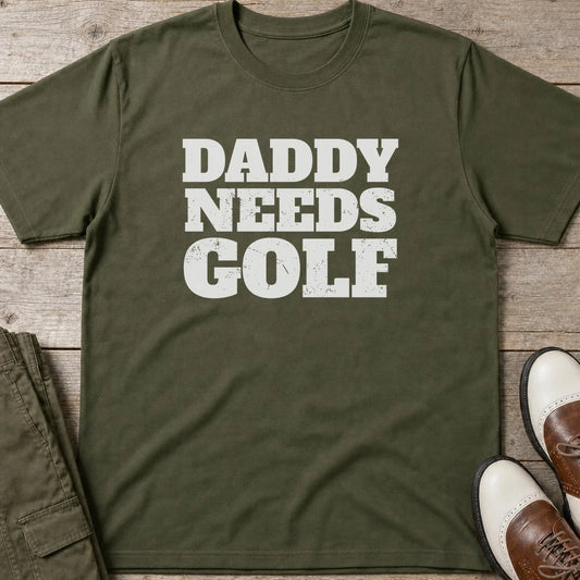Daddy Needs Golf T-Shirt in Military Green lying on a plain floor. T-shirt is a unisex cut and 100 per cent cotton.