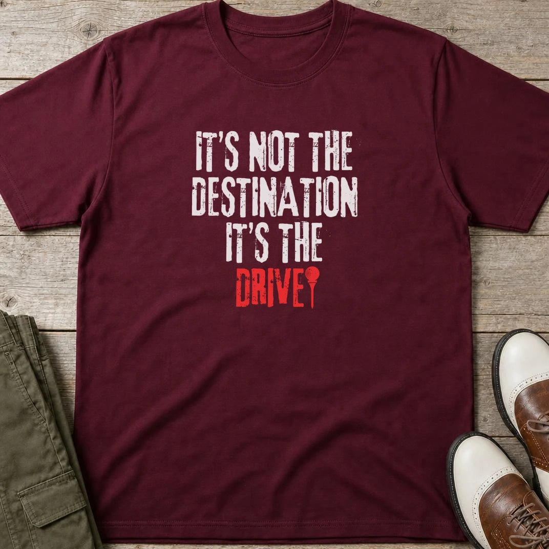 Destination T-Shirt in Maroon lying on a plain floor. T-shirt is a unisex cut and 100 per cent cotton.