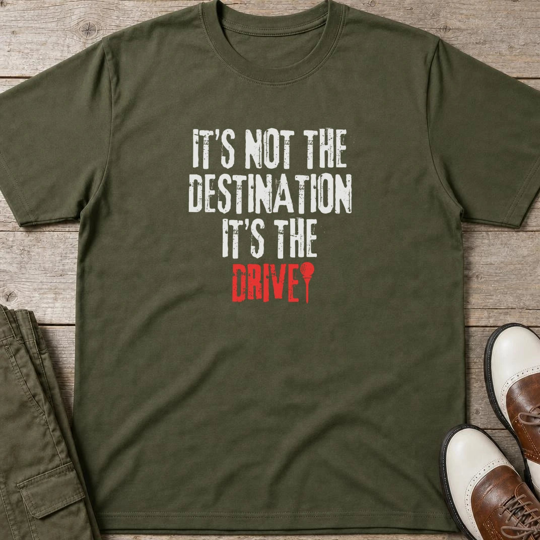 Destination T-Shirt in Military Green lying on a plain floor. T-shirt is a unisex cut and 100 per cent cotton.