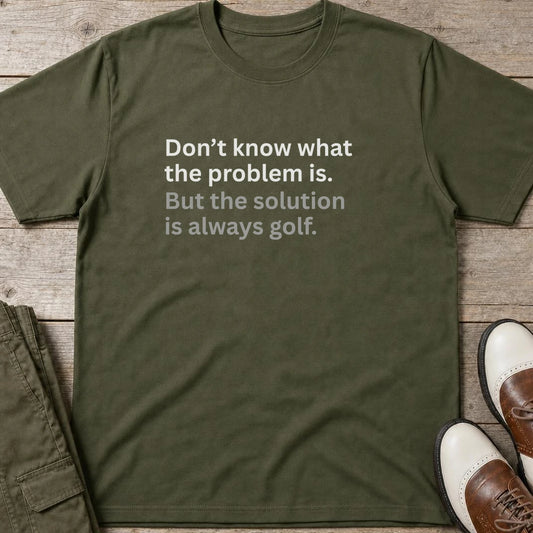 Solution Golf T-Shirt in Military Green lying on a plain floor. T-shirt is a unisex cut and 100 per cent cotton.