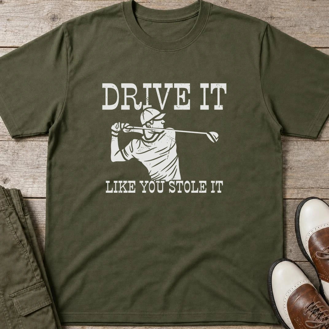Stole It T-Shirt in Military Green lying on a plain floor. T-shirt is a unisex cut and 100 per cent cotton.
