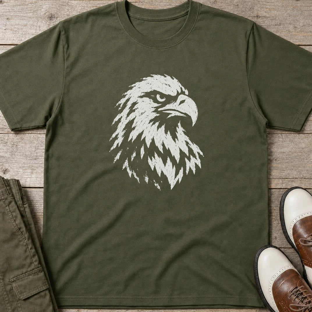 Eagle Graphic T-Shirt in Military Green lying on a plain floor. T-shirt is a unisex cut and 100 per cent cotton.