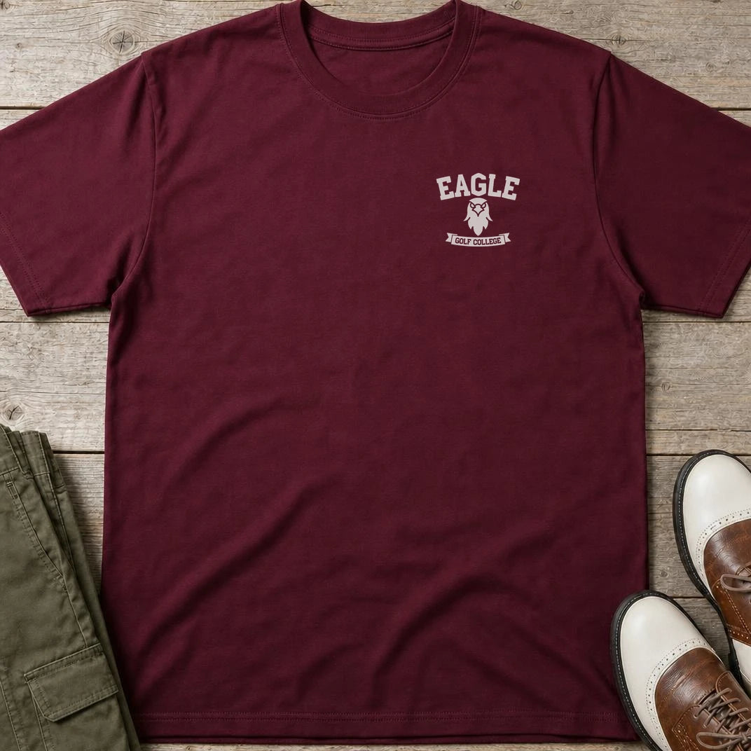 Eagle College Pocket T-Shirt in Maroon lying on a plain floor. T-shirt is a unisex cut and 100 per cent cotton.