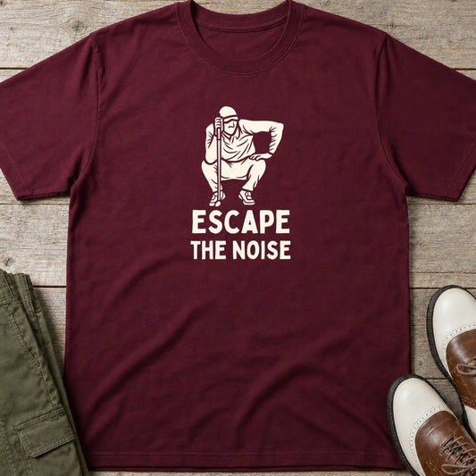 Escape T-Shirt in Maroon lying on a plain floor. T-shirt is a unisex cut and 100 per cent cotton.