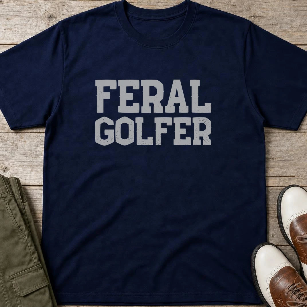 Feral Golfer T-Shirt in Navy lying on a plain floor. T-shirt is a unisex cut and 100 per cent cotton.