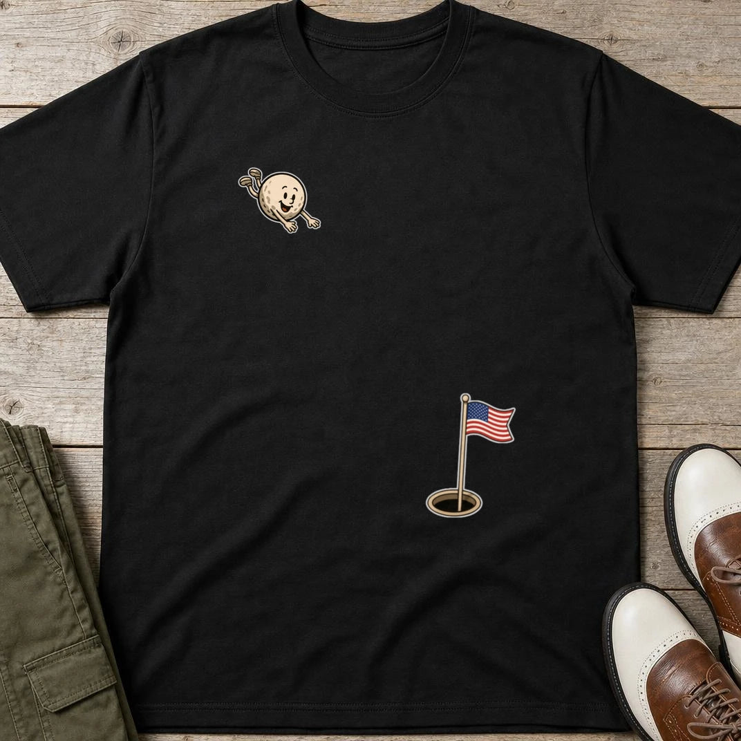Flying Golf USA T-Shirt in Black lying on a plain floor. T-shirt is a unisex cut and 100 per cent cotton.