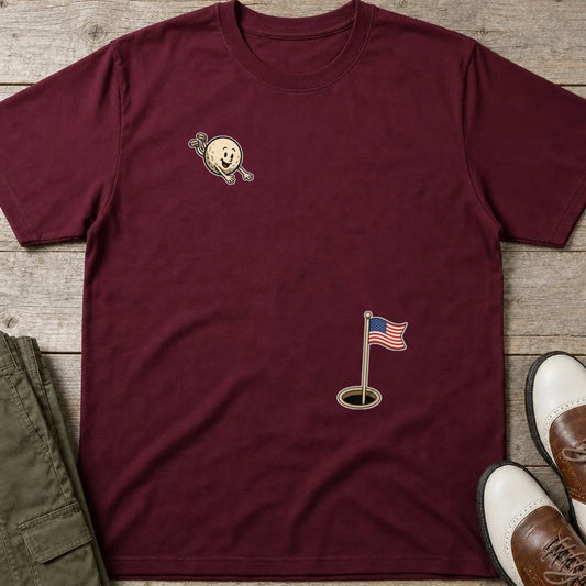 Flying Golf USA T-Shirt in Maroon lying on a plain floor. T-shirt is a unisex cut and 100 per cent cotton.
