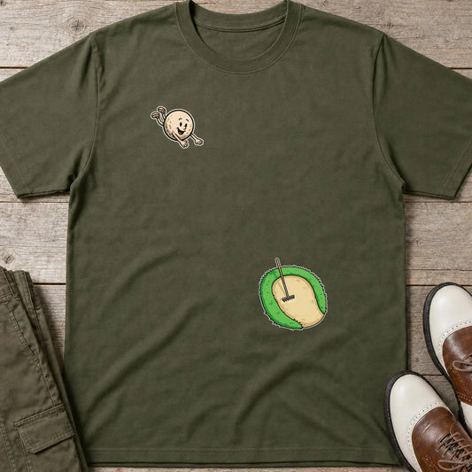 Flying Sand Trap T-Shirt in Military Green lying on a plain floor. T-shirt is a unisex cut and 100 per cent cotton.