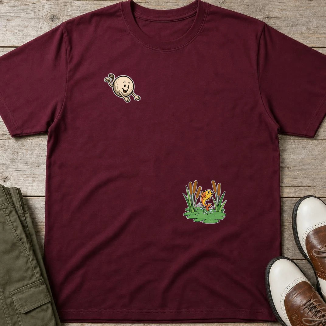 Flying Golf Pond T-Shirt in Maroon lying on a plain floor. T-shirt is a unisex cut and 100 per cent cotton.