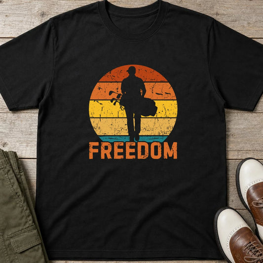 Freedom Golfer T-Shirt in lying on a plain floor. T-shirt is a unisex cut and 100 per cent cotton.