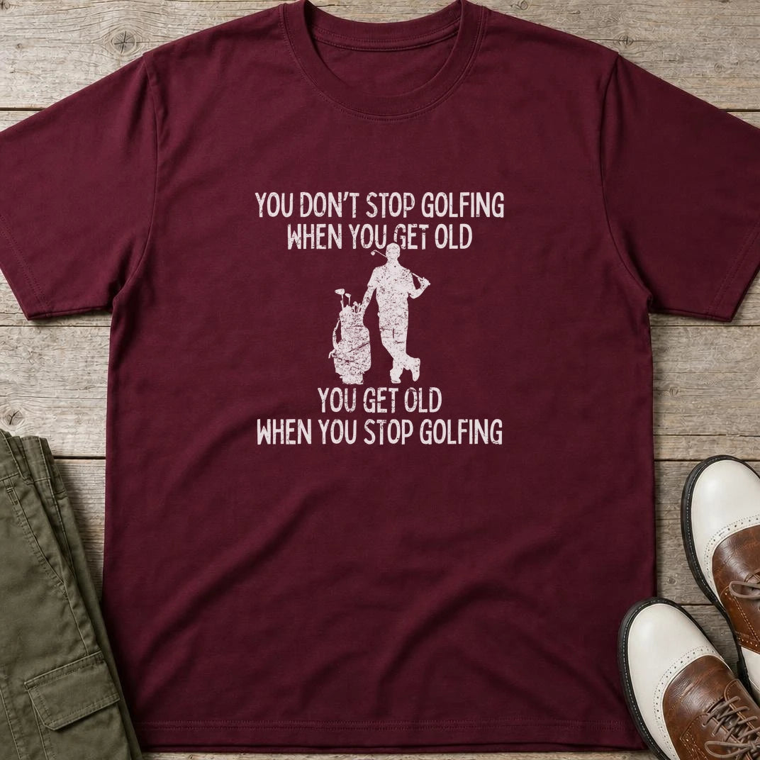 Get Old T-Shirt in Maroon lying on a plain floor. T-shirt is a unisex cut and 100 per cent cotton.