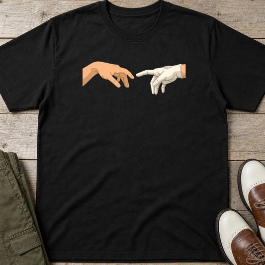 The Glove of God T-Shirt in Black lying on a plain floor. T-shirt is a unisex cut and 100 per cent cotton.
