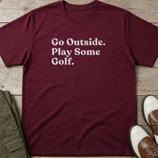 Go Outside T-Shirt in Maroon lying on a plain floor. T-shirt is a unisex cut and 100 per cent cotton.