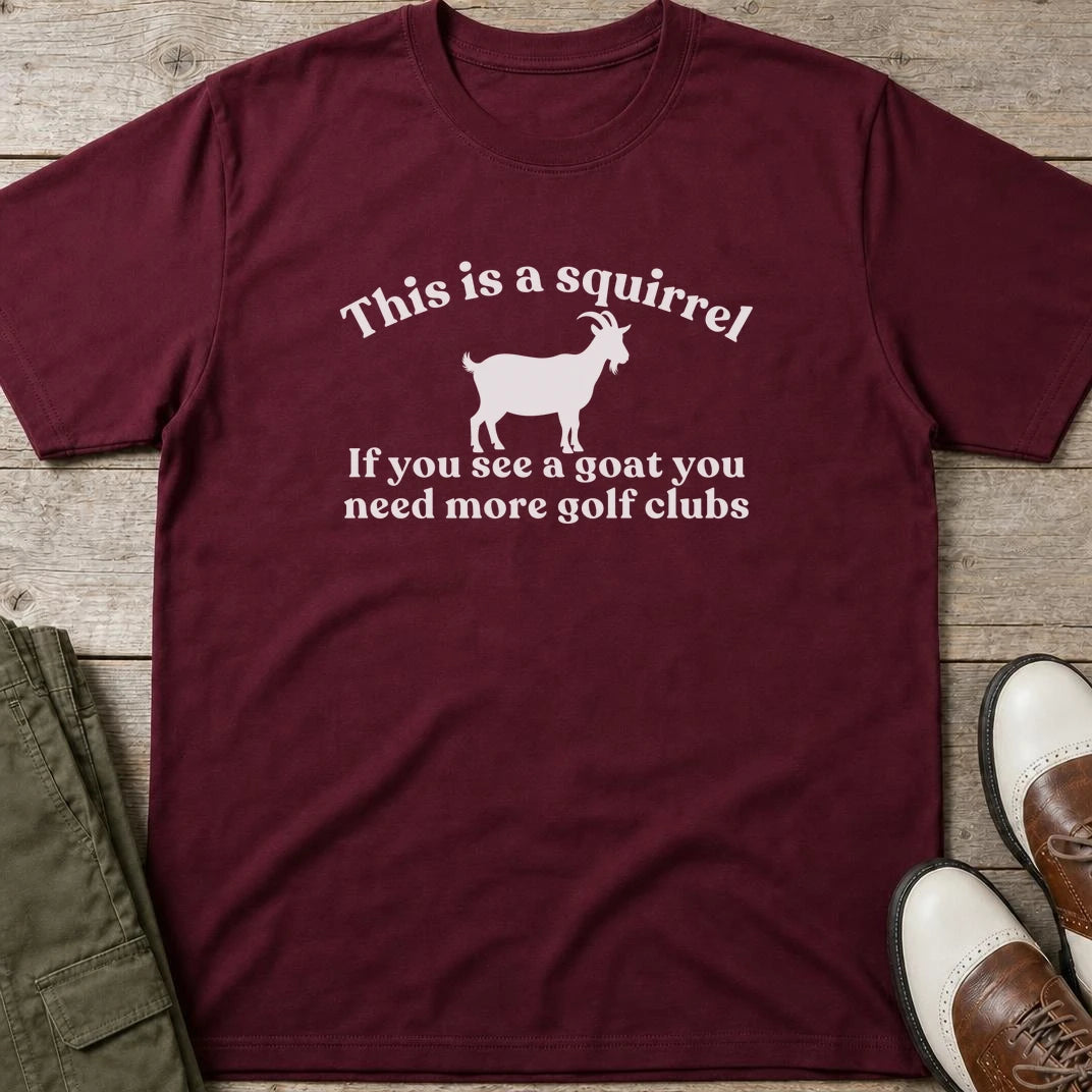 Goat T-Shirt in Maroon lying on a plain floor. T-shirt is a unisex cut and 100 per cent cotton.