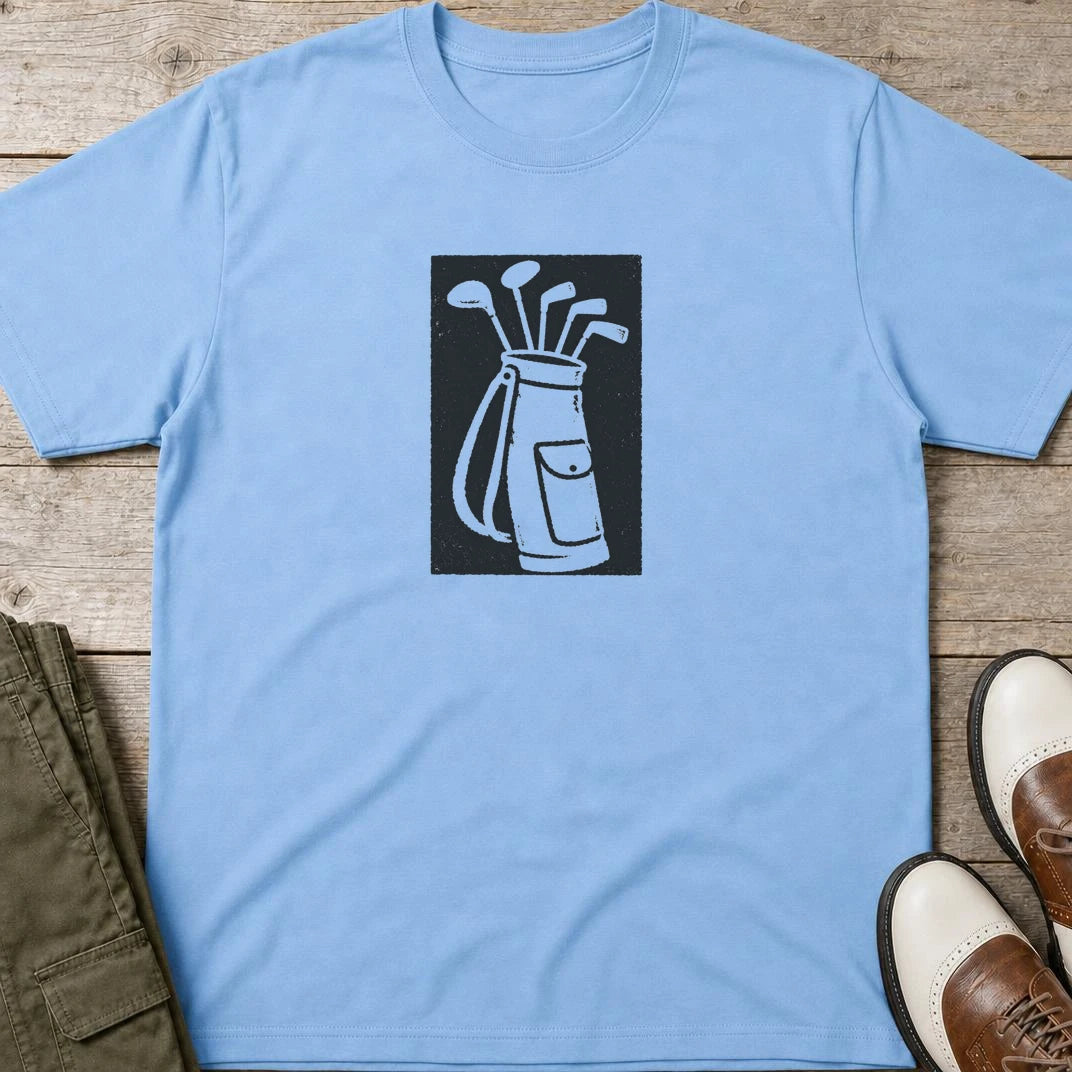 Block-Print Golf T-Shirt in Light Blue lying on a plain floor. T-shirt is a unisex cut and 100 per cent cotton.