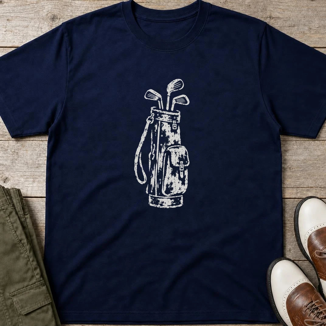 Vintage Golf Bag T-Shirt in Navy lying on a plain floor. T-shirt is a unisex cut and 100 per cent cotton.