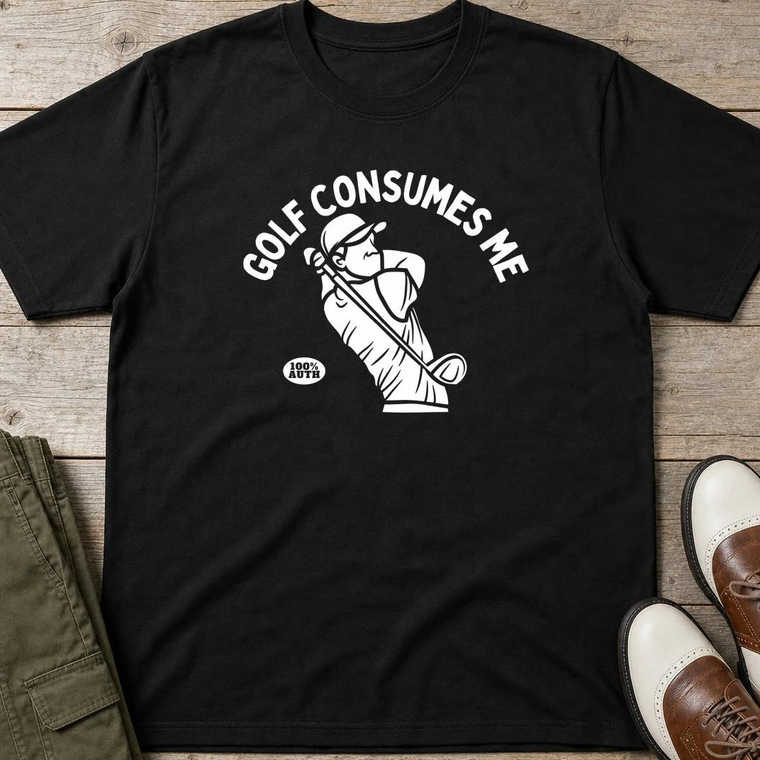 Golf Consumes Me T-Shirt in Black lying on a plain floor. T-shirt is a unisex cut and 100 per cent cotton.