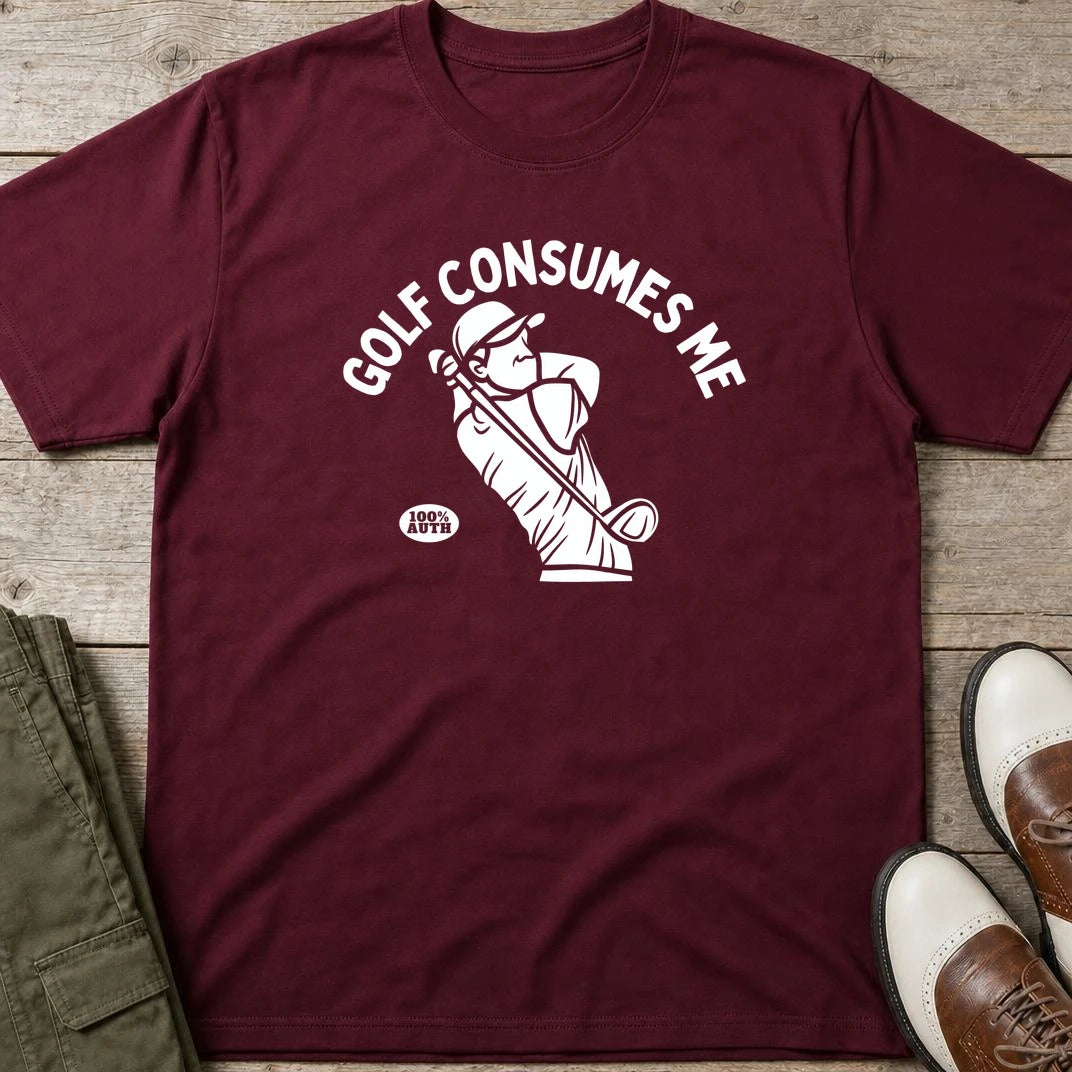 Golf Consumes Me T-Shirt in Maroon lying on a plain floor. T-shirt is a unisex cut and 100 per cent cotton.
