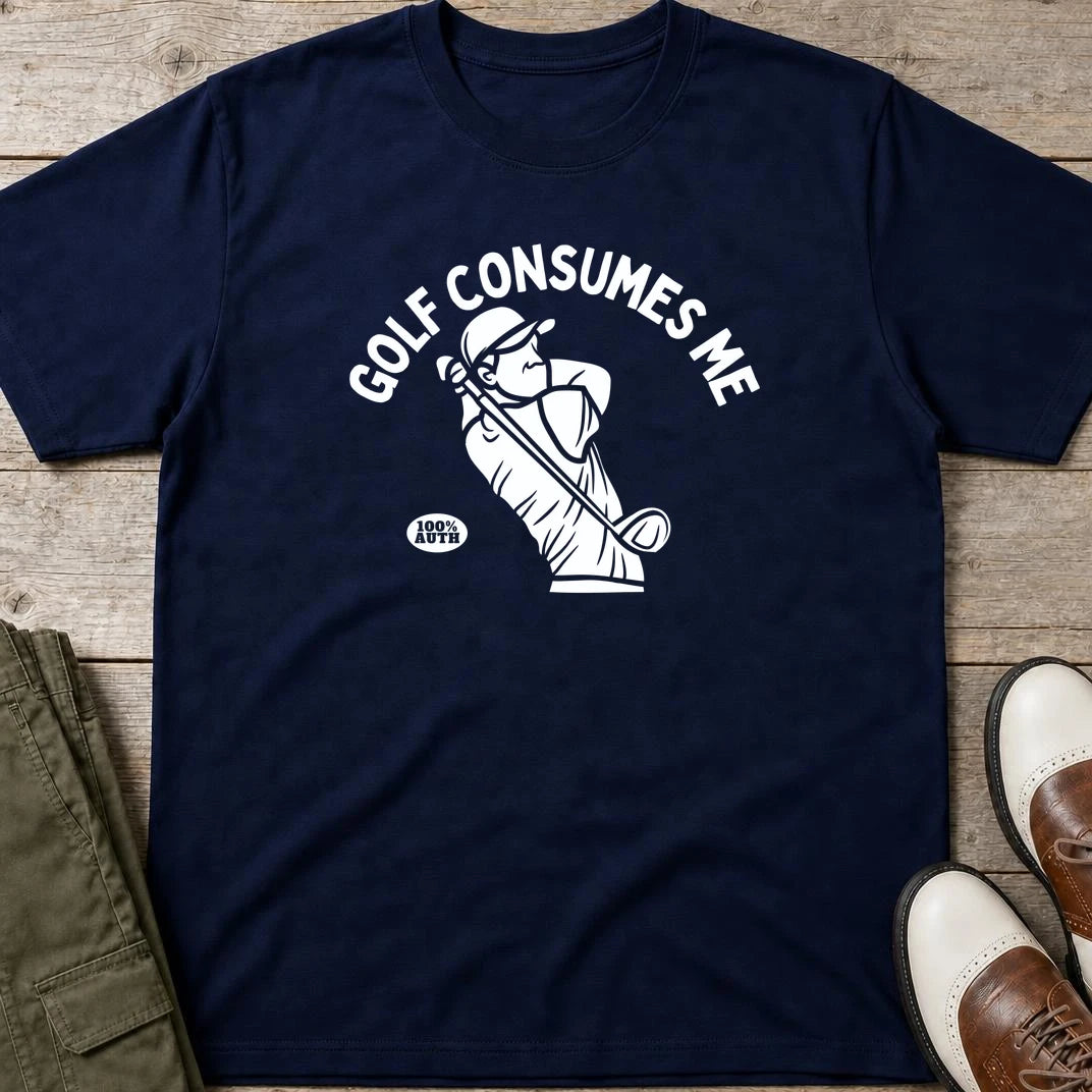 Golf Consumes Me T-Shirt in Navy lying on a plain floor. T-shirt is a unisex cut and 100 per cent cotton.