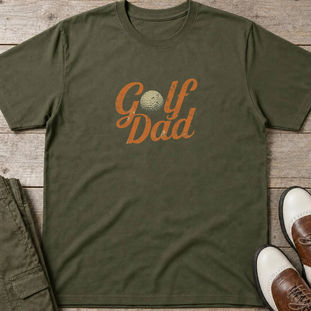 Golf Dad II T-Shirt in Military Green lying on a plain floor. T-shirt is a unisex cut and 100 per cent cotton.