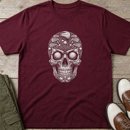 Golf Gear Skull T-Shirt in Maroon lying on a plain floor. T-shirt is a unisex cut and 100 per cent cotton.