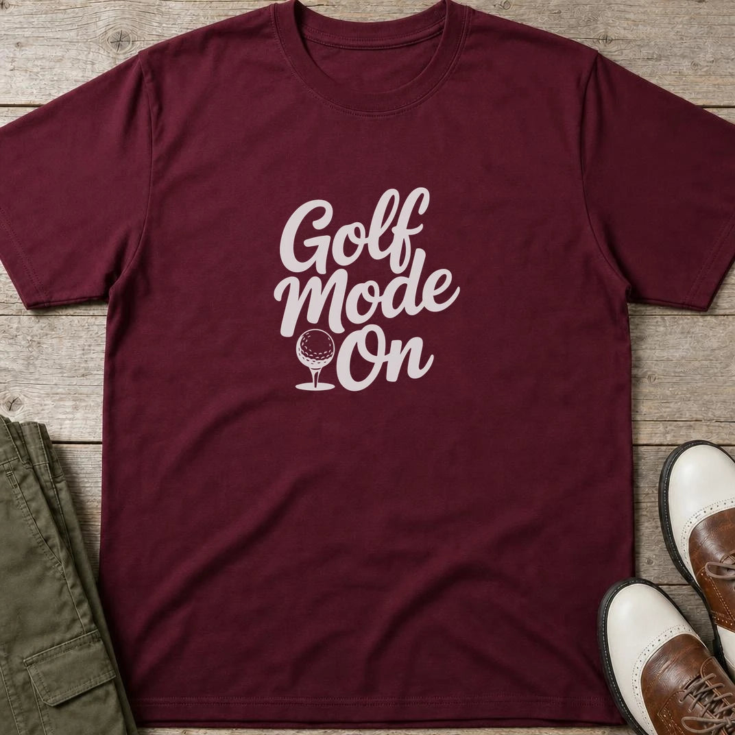 Mode T-Shirt in Maroon lying on a plain floor. T-shirt is a unisex cut and 100 per cent cotton.