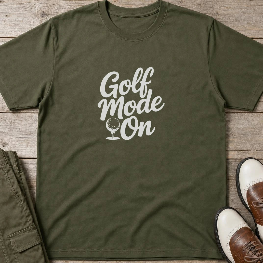 Mode T-Shirt in Military Green lying on a plain floor. T-shirt is a unisex cut and 100 per cent cotton.