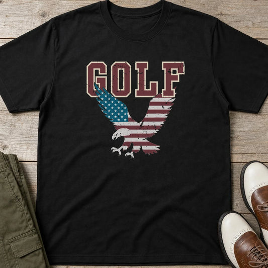 Golf USA Eagle T-Shirt in Black lying on a plain floor. T-shirt is a unisex cut and 100 per cent cotton.