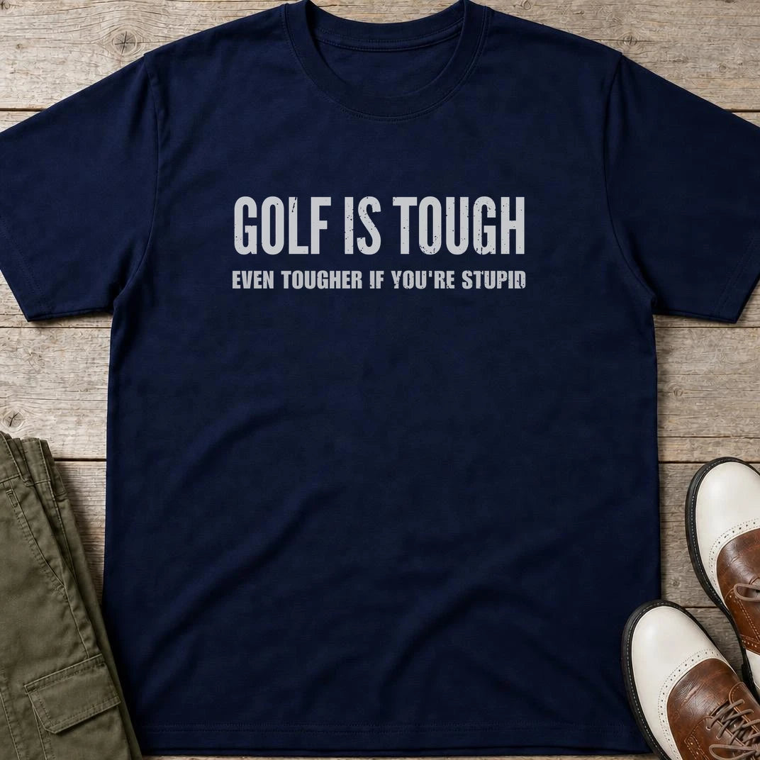 Golf Is Tough T-Shirt in Navy lying on a plain floor. T-shirt is a unisex cut and 100 per cent cotton.