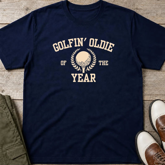 Golfin' Oldie T-Shirt in Navy lying on a plain floor. T-shirt is a unisex cut and 100 per cent cotton.