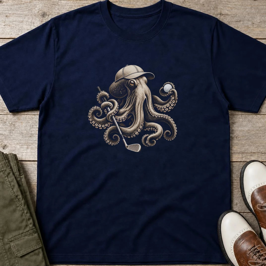 Golfing Octopus T-Shirt in Navy lying on a plain floor. T-shirt is a unisex cut and 100 per cent cotton.
