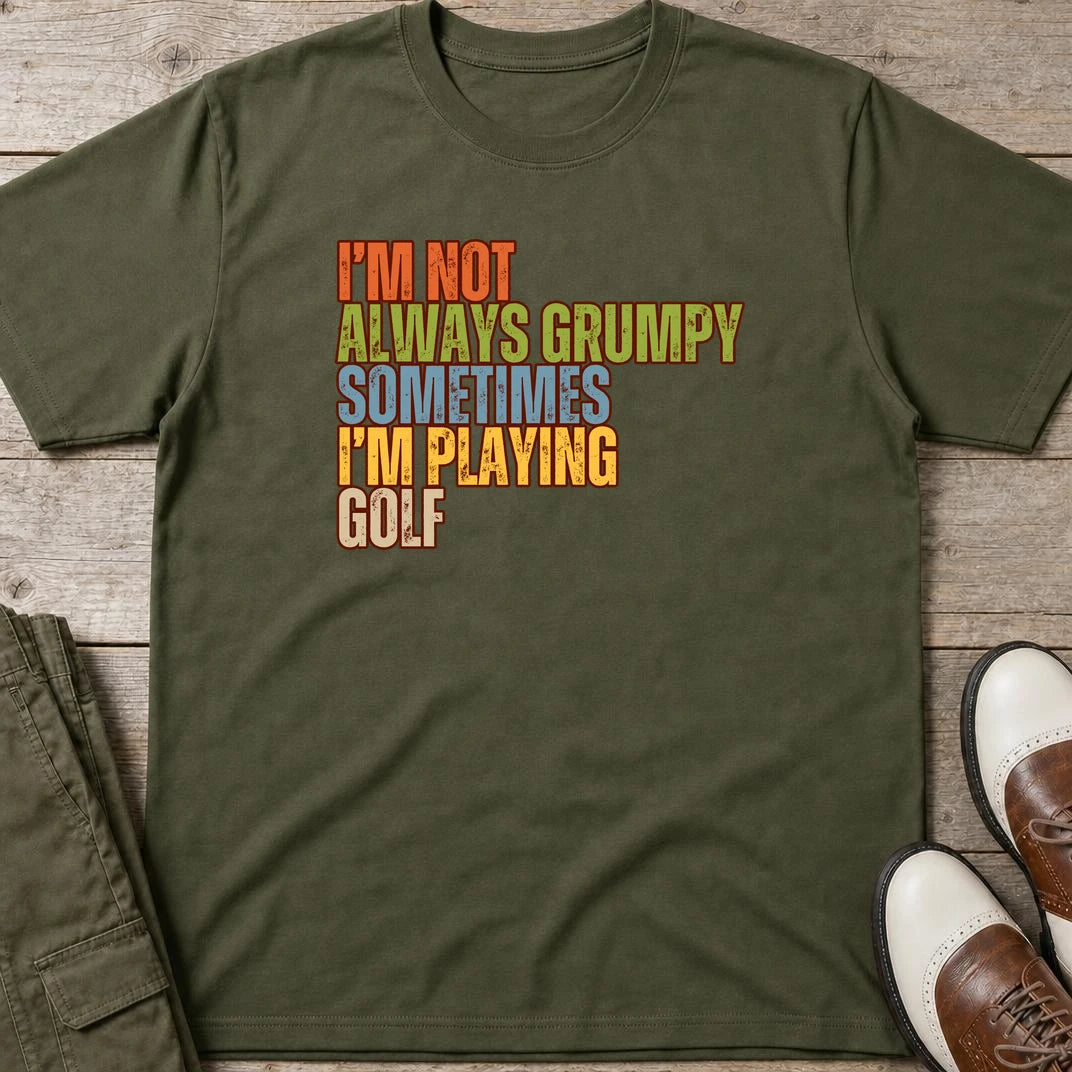 Grumpy Classic T-Shirt in Military Green lying on a plain floor. T-shirt is a unisex cut and 100 per cent cotton.