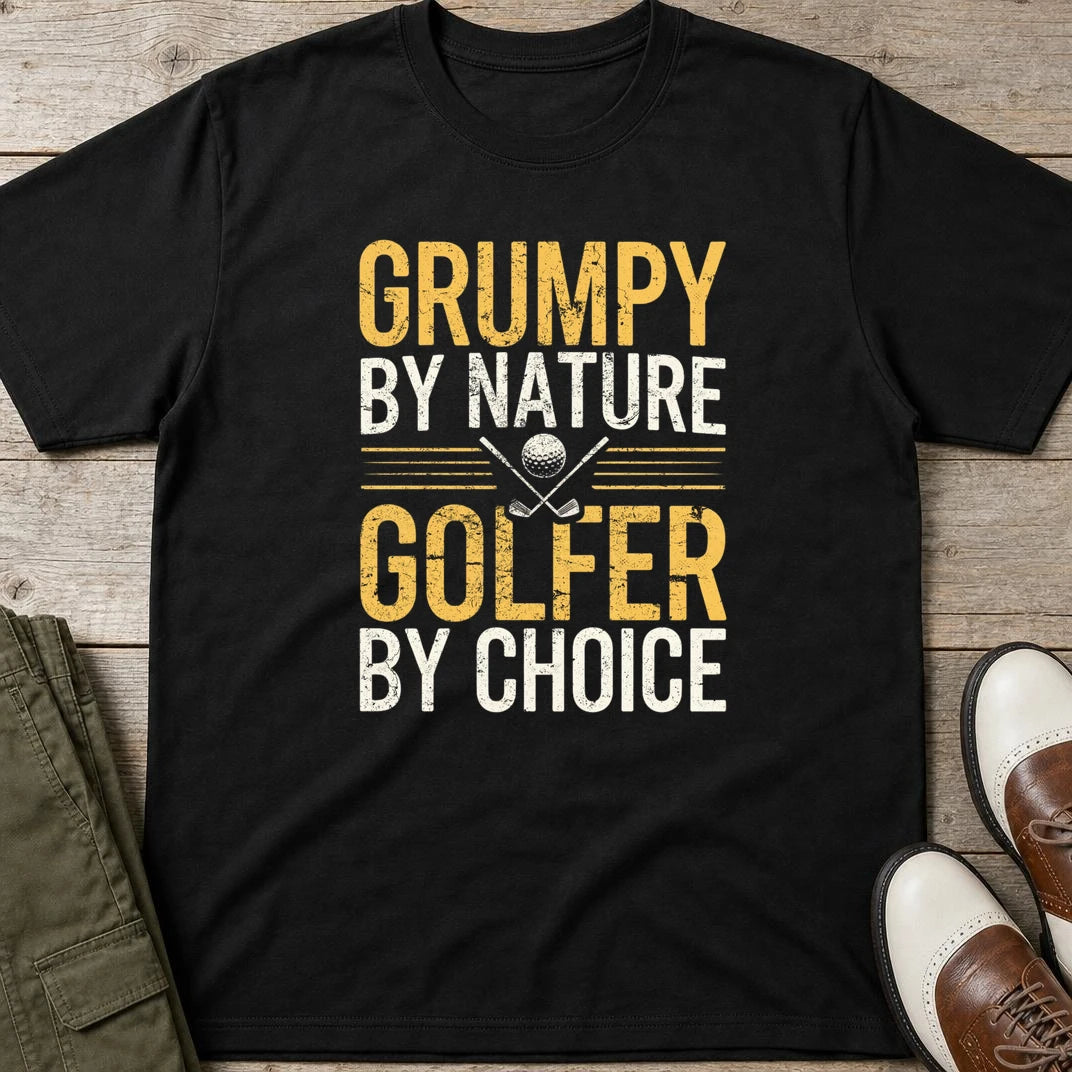 Grumpy By Nature T-Shirt in Black lying on a plain floor. T-shirt is a unisex cut and 100 per cent cotton.