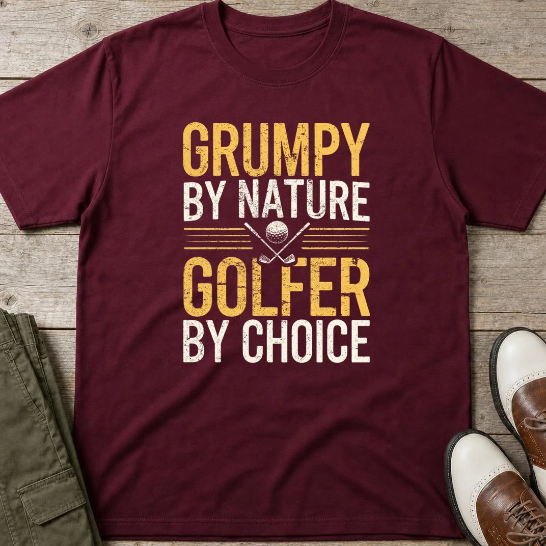 Grumpy By Nature T-Shirt in Maroon lying on a plain floor. T-shirt is a unisex cut and 100 per cent cotton.