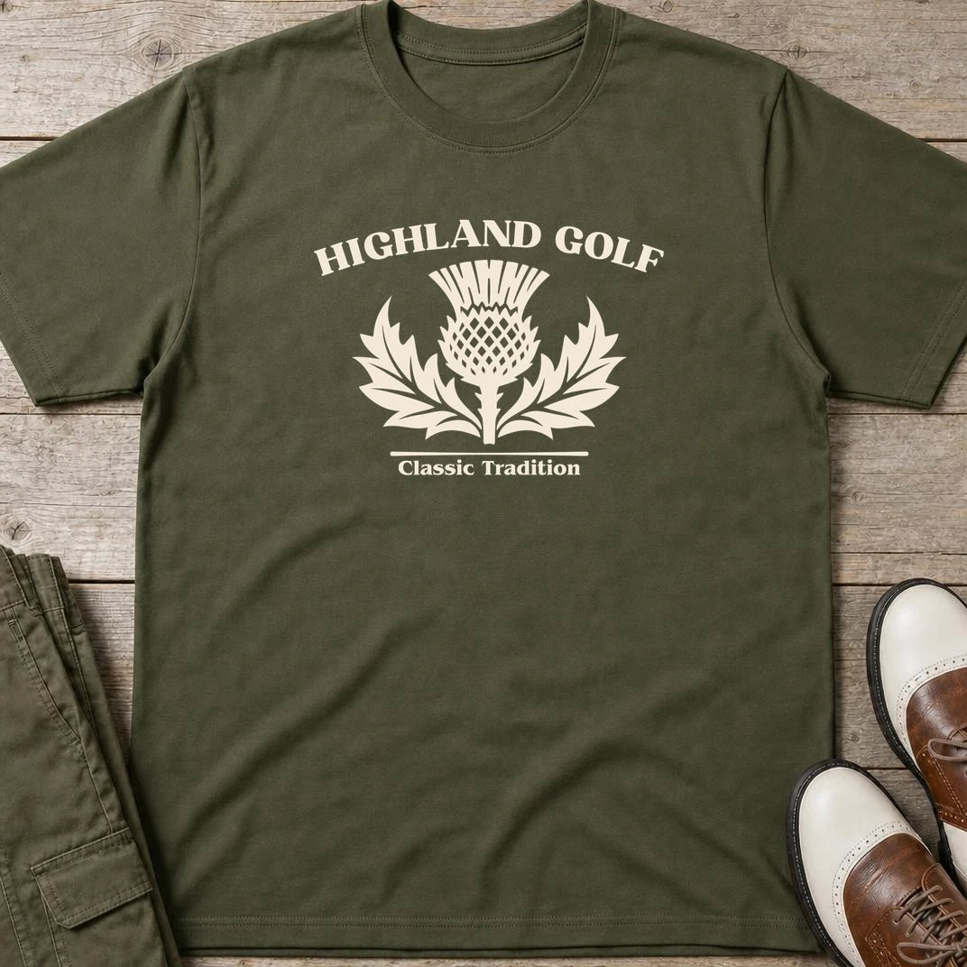 Highland Golf T-Shirt in Military Green lying on a plain floor. T-shirt is a unisex cut and 100 per cent cotton.