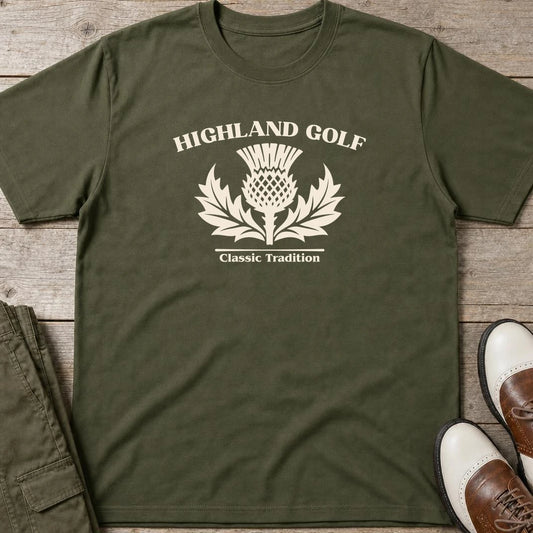 Highland Golf T-Shirt in Military Green lying on a plain floor. T-shirt is a unisex cut and 100 per cent cotton.