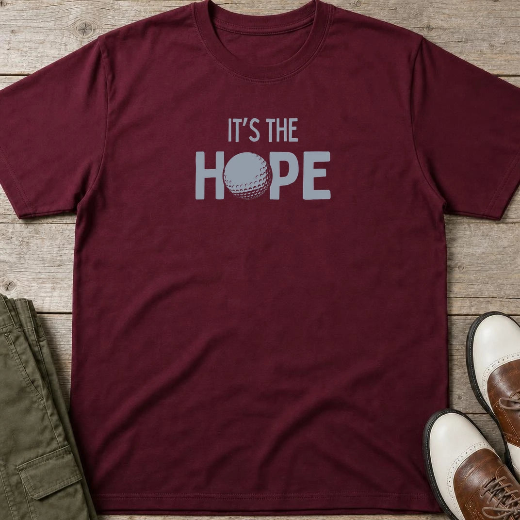 The Hope T-Shirt in Maroon lying on a plain floor. T-shirt is a unisex cut and 100 per cent cotton.