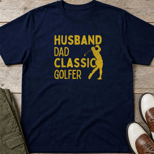 Husband Dad T-Shirt in Navy lying on a plain floor. T-shirt is a unisex cut and 100 per cent cotton.