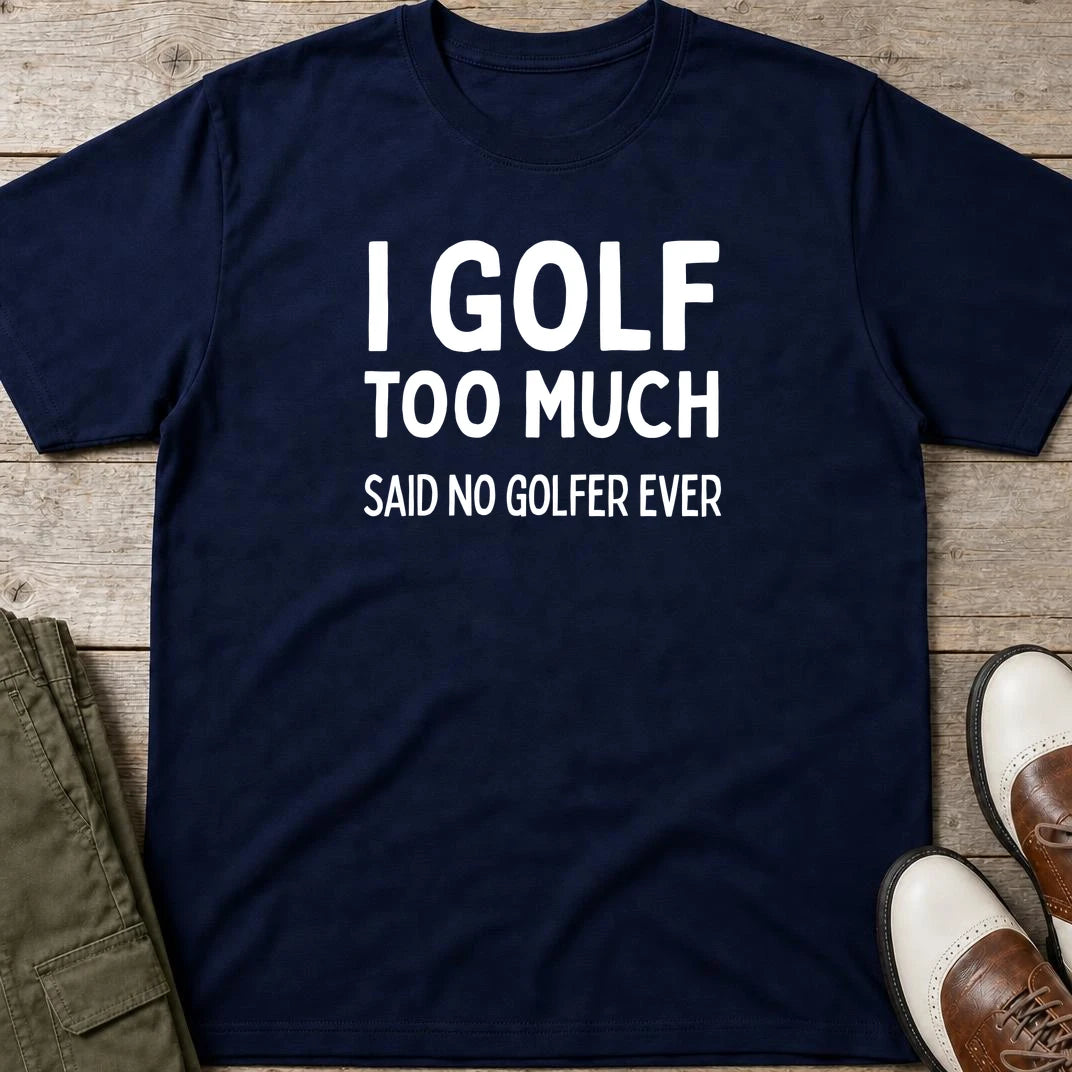 Golf Too Much T-Shirt in Navy lying on a plain floor. T-shirt is a unisex cut and 100 per cent cotton.