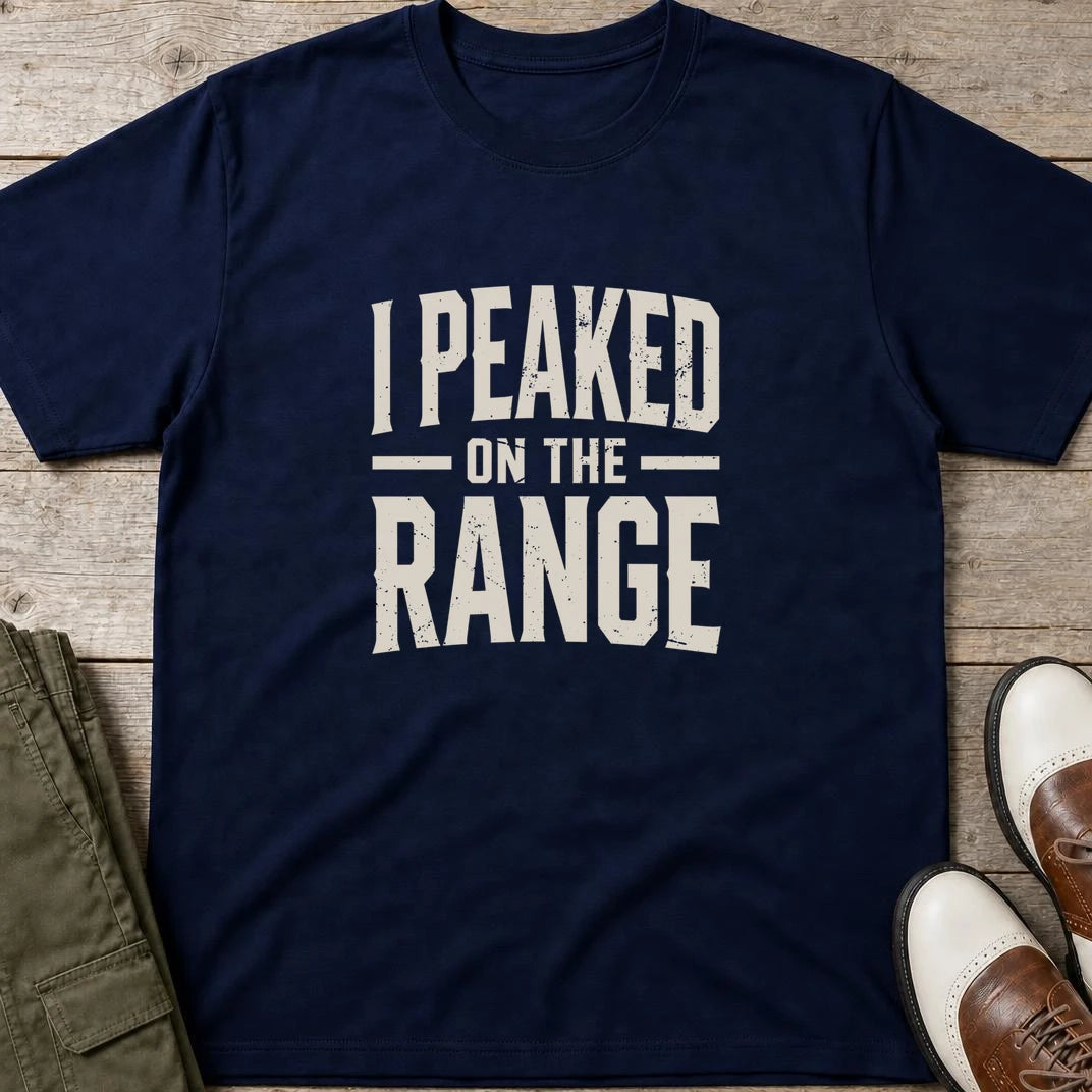 I Peaked T-Shirt in Navy lying on a plain floor. T-shirt is a unisex cut and 100 per cent cotton.