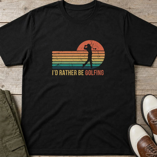 Rather Be Golfing T-Shirt in Black lying on a plain floor. T-shirt is a unisex cut and 100 per cent cotton.