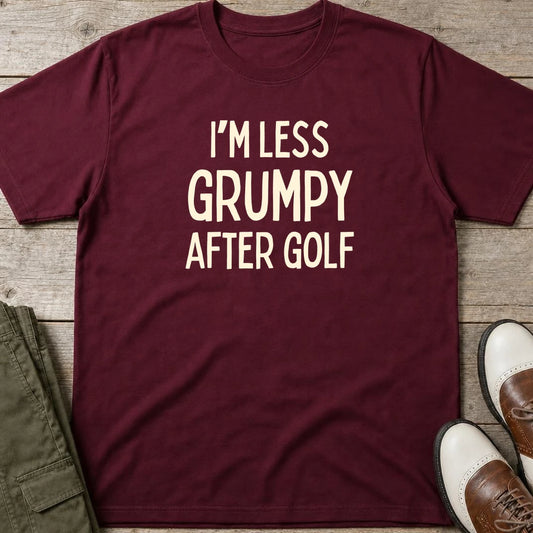 I'm Less Grumpy After Golf T-Shirt in Maroon lying on a plain floor. T-shirt is a unisex cut and 100 per cent cotton.