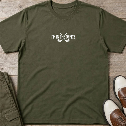In The Office T-Shirt in Military Green lying on a plain floor. T-shirt is a unisex cut and 100 per cent cotton.