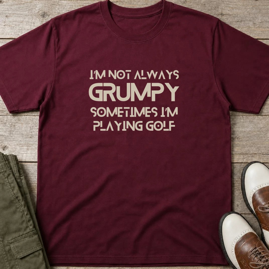 Grumpy Pure (no grunge font) T-Shirt in Maroon lying on a plain floor. T-shirt is a unisex cut and 100 per cent cotton.